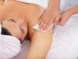 Gentle waxing service on a relaxed client